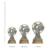 Football Pearl trophies next to ruler