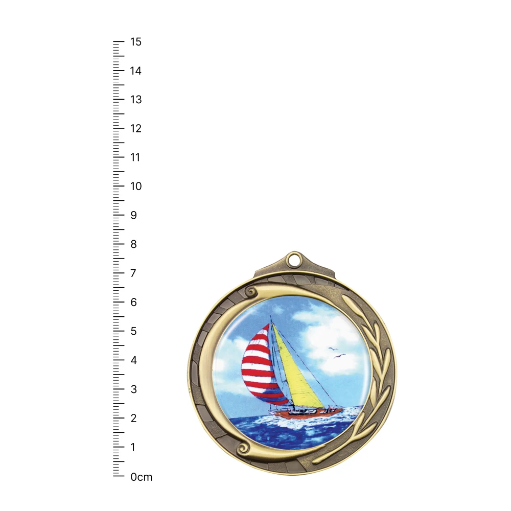 Sailing Wreath gold next to ruler