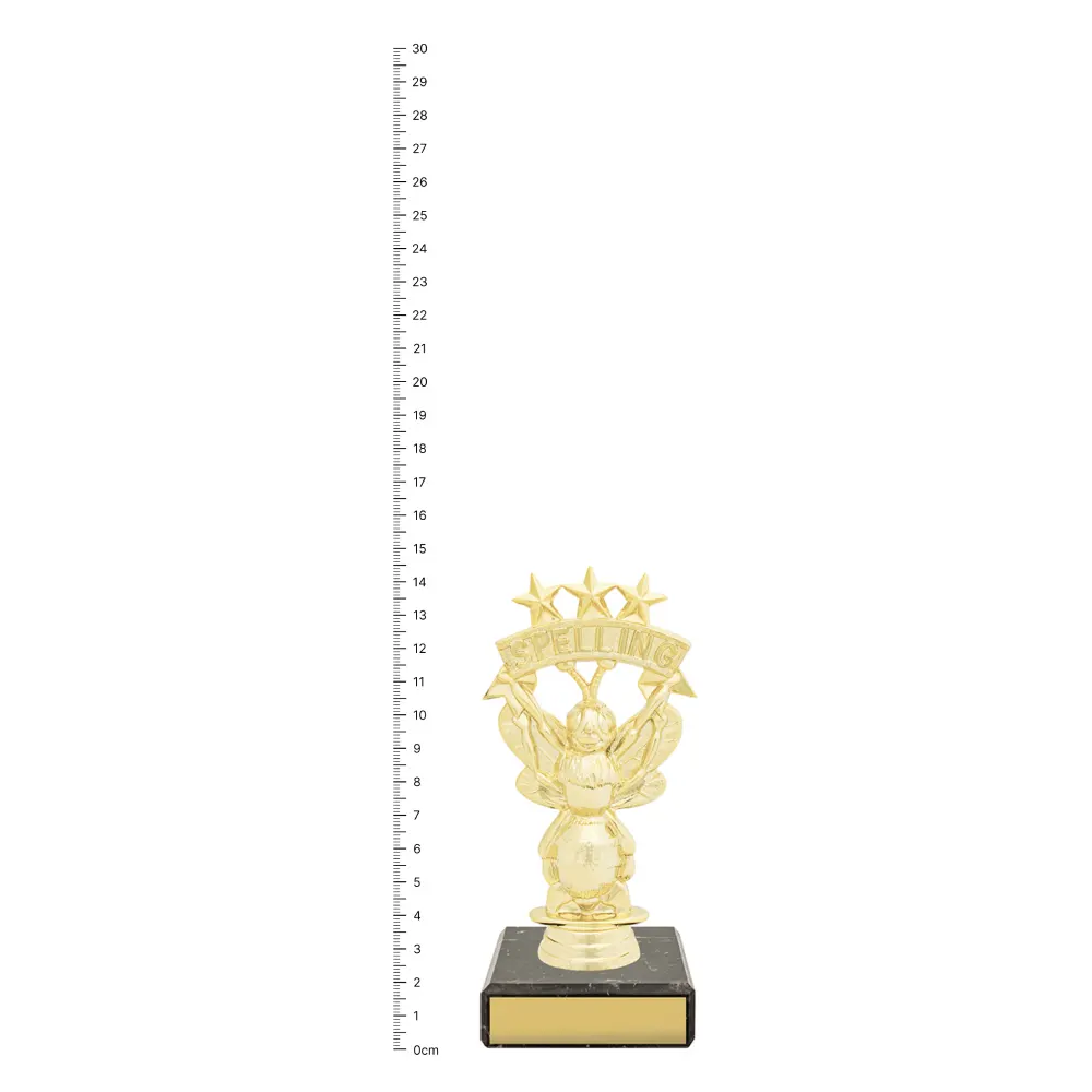 Spelling Bee Figure Trophy next to ruler