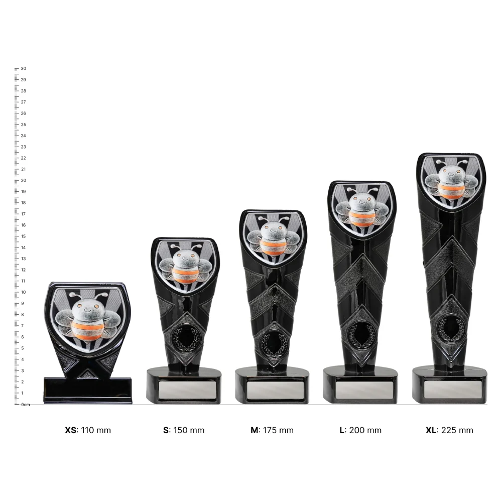 Spelling Black Cobra trophies next to ruler