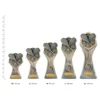 Squash Gladiator Series trophies next to ruler